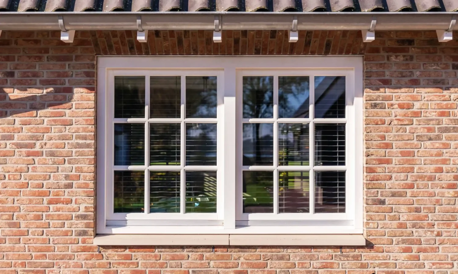 Ruime schuurwoning met natuurlijke materialen en zinken details, gerealiseerd door Holtkamp Bouw in Rectum